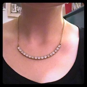 Pale pink gem necklace.